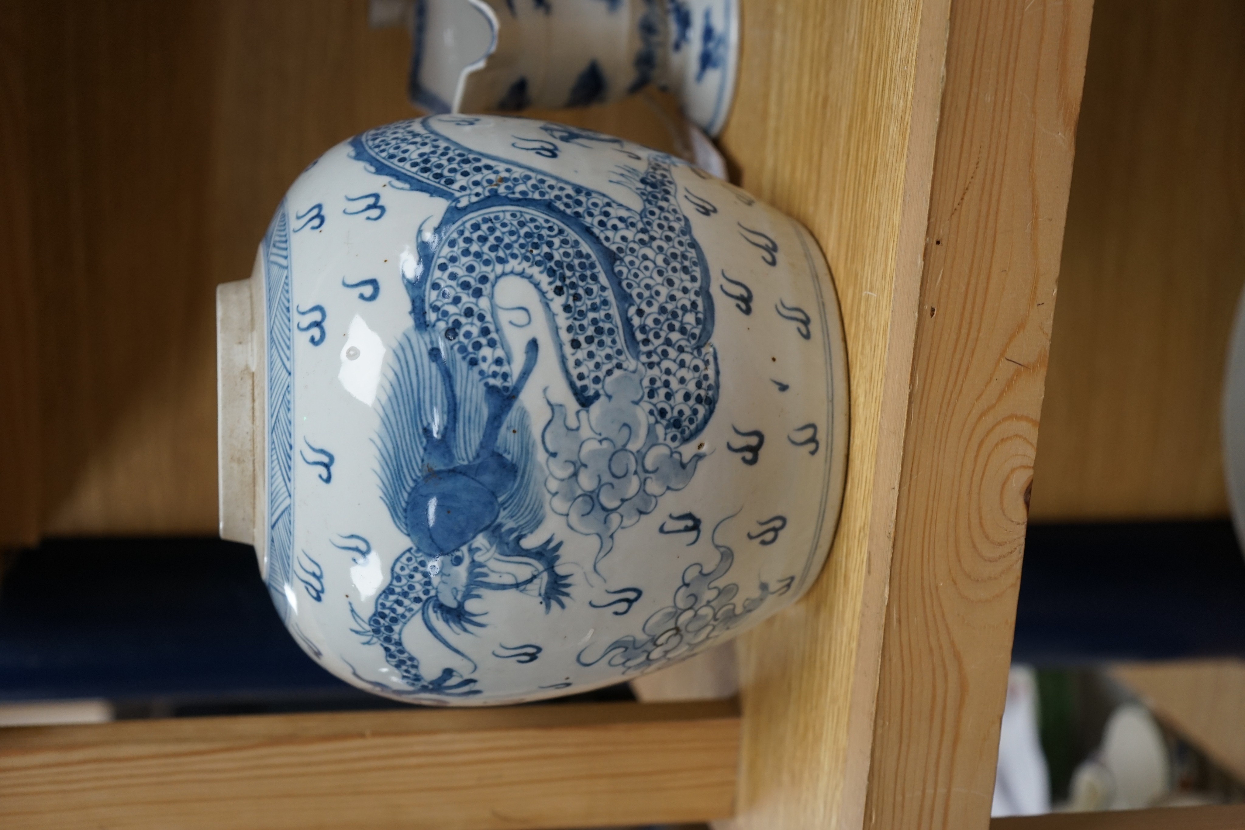 A Chinese blue and white jar, 20cm and a helmet shaped jug, 18th century and later